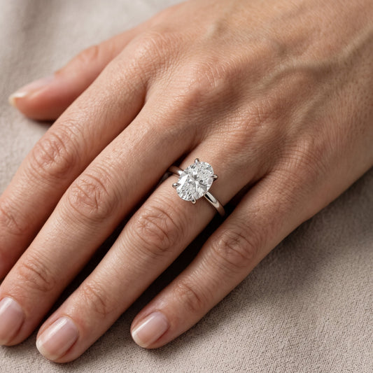 Cassandra Claw Prong Solitaire Oval Diamond Engagement Ring in Platinum - lifestyle.jpg