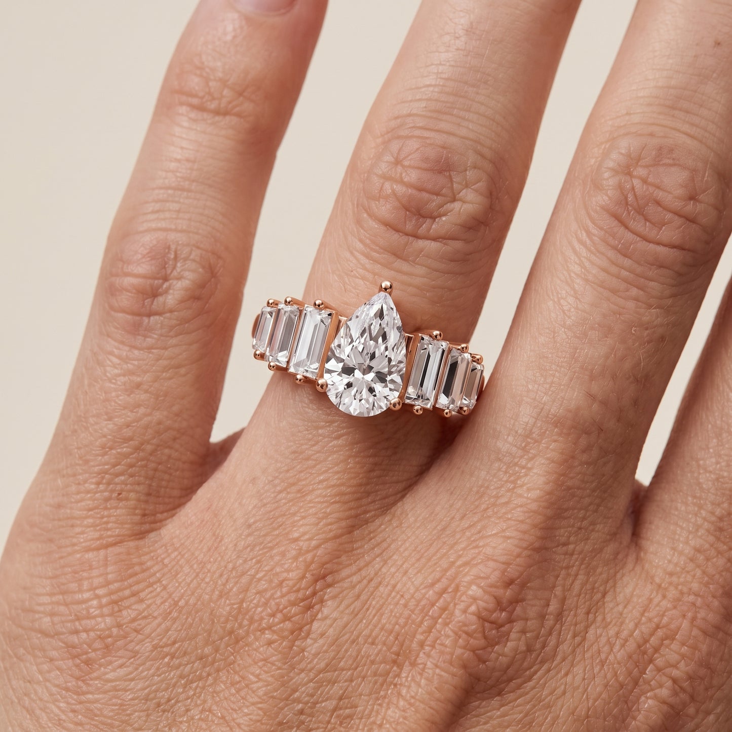 Mara Sidestone Baguette Accent Pear Diamond Engagement Ring in Rose Gold - lifestyle.jpg