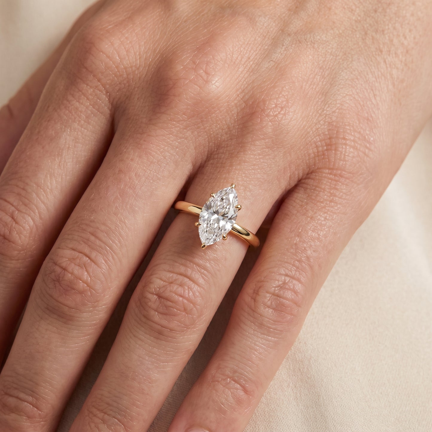 Mena Hidden Halo Marquise Diamond Engagement Ring in Yellow Gold - lifestyle.jpg