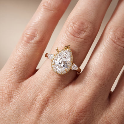 Eliza Halo Sidestone Pear Diamond Engagement Ring in Yellow Gold - lifestyle.jpg