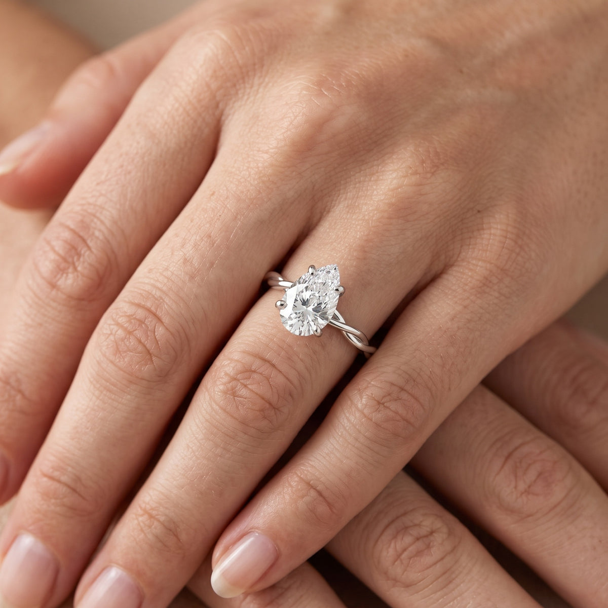 Iris Twist Pear Diamond Engagement Ring in White Gold - lifestyle.jpg