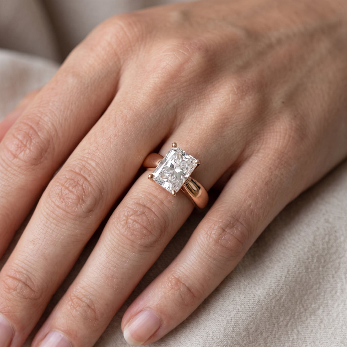 Talia Solitaire Twist Radiant Diamond Engagement Ring in Rose Gold - lifestyle.jpg