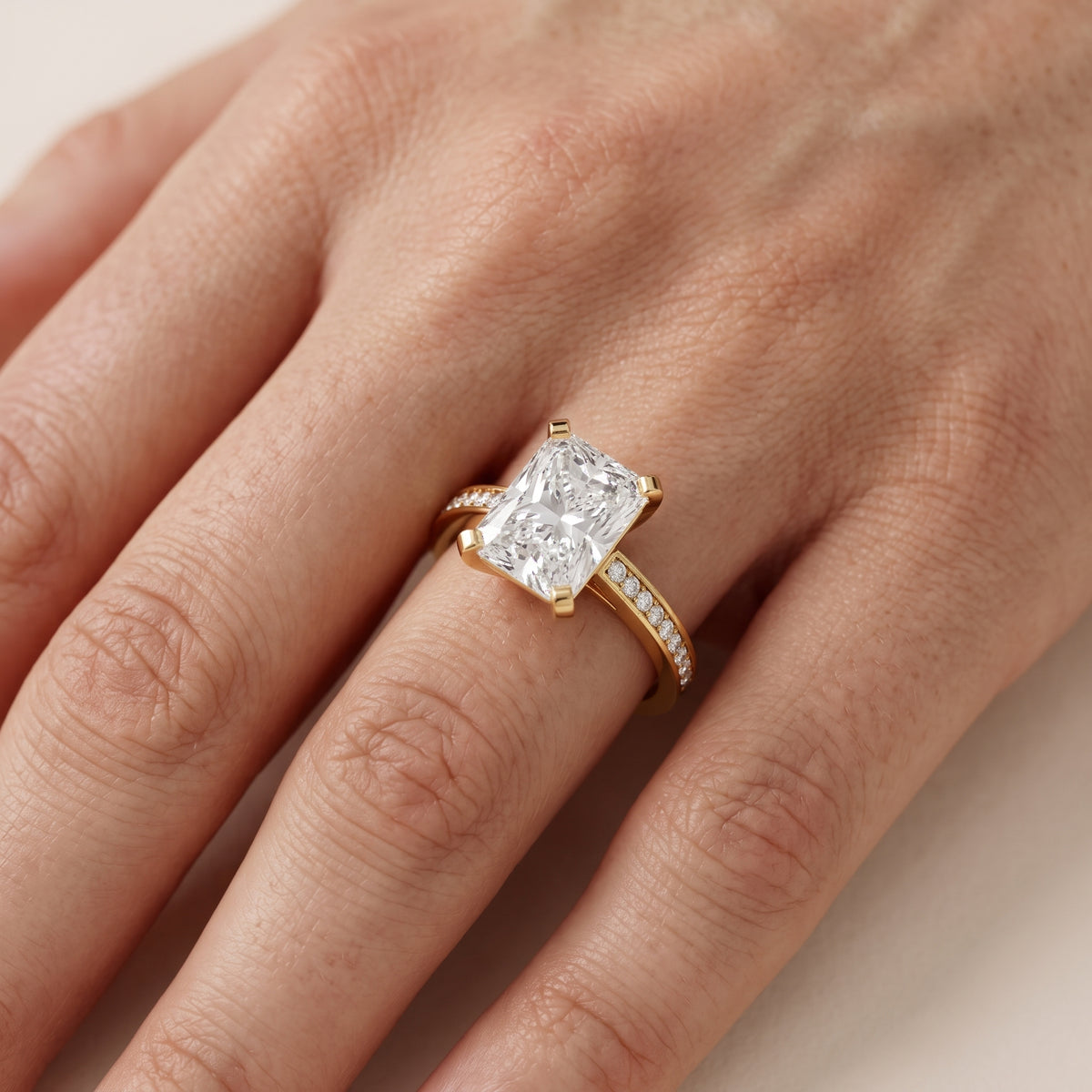 Tessa Solitaire Channel Set Radiant Diamond Engagement Ring in Yellow Gold - lifestyle.jpg