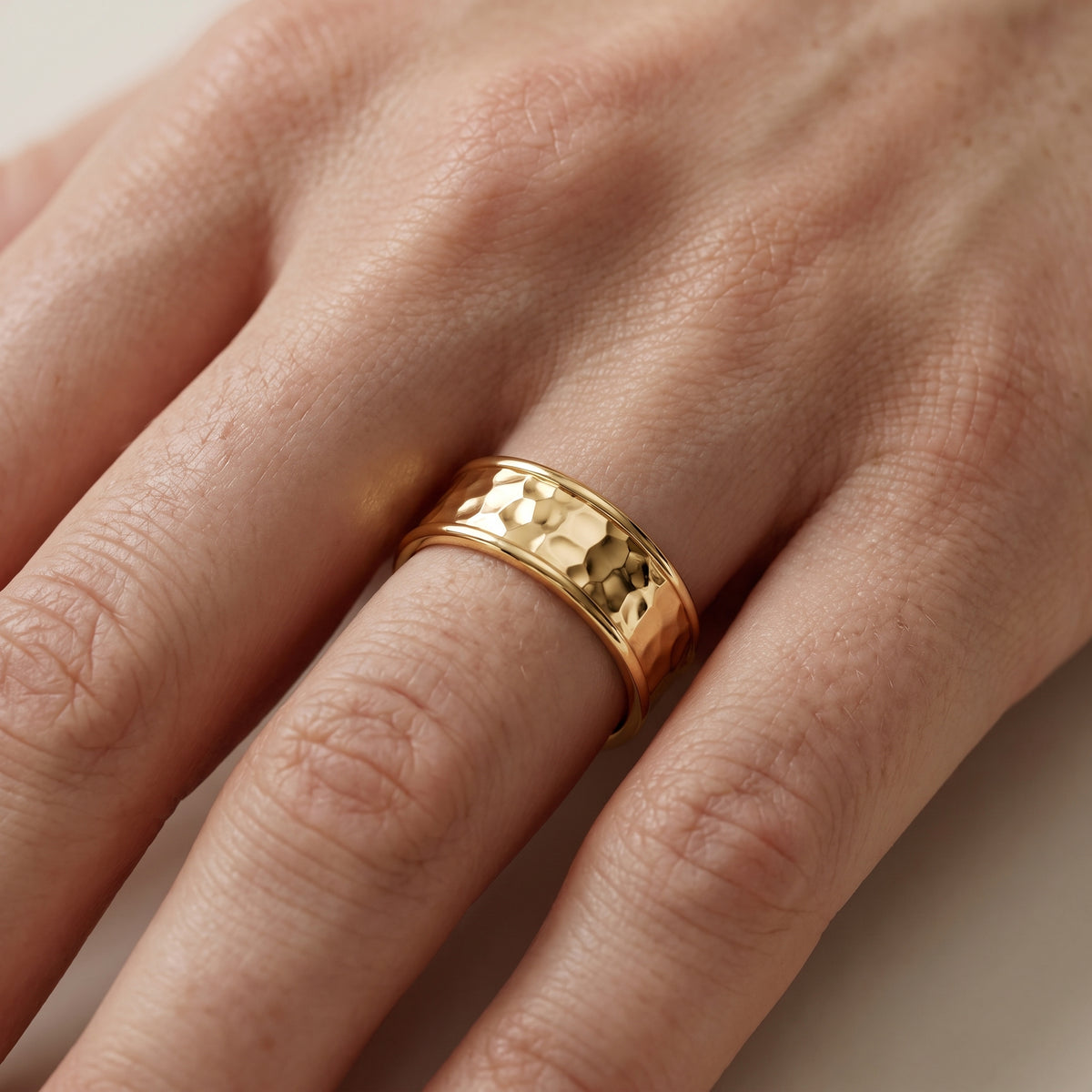 Paige Hammered Step Edge Wedding Band in Yellow Gold - lifestyle.jpg