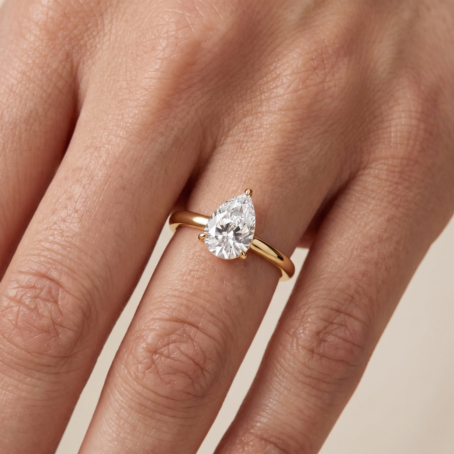 Sadie Cathedral Solitaire Pear Diamond Ring in Yellow Gold - lifestyle.jpg