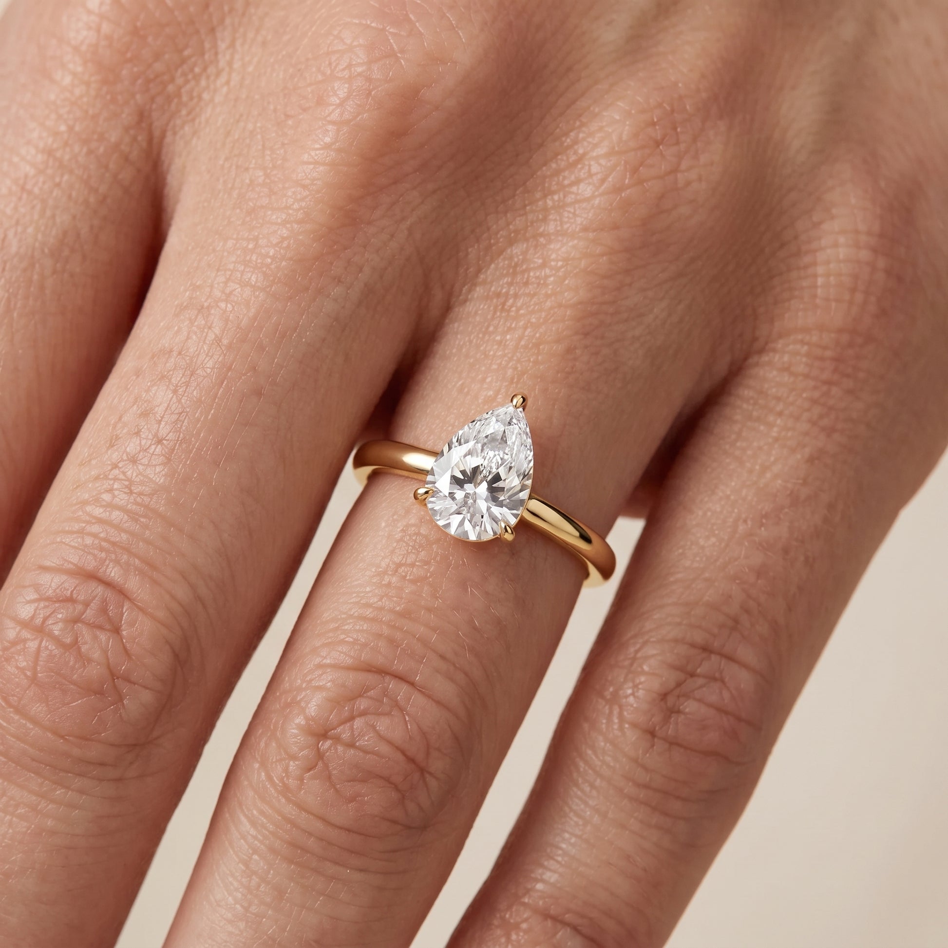 Sadie Cathedral Solitaire Pear Diamond Ring in Yellow Gold - lifestyle.jpg