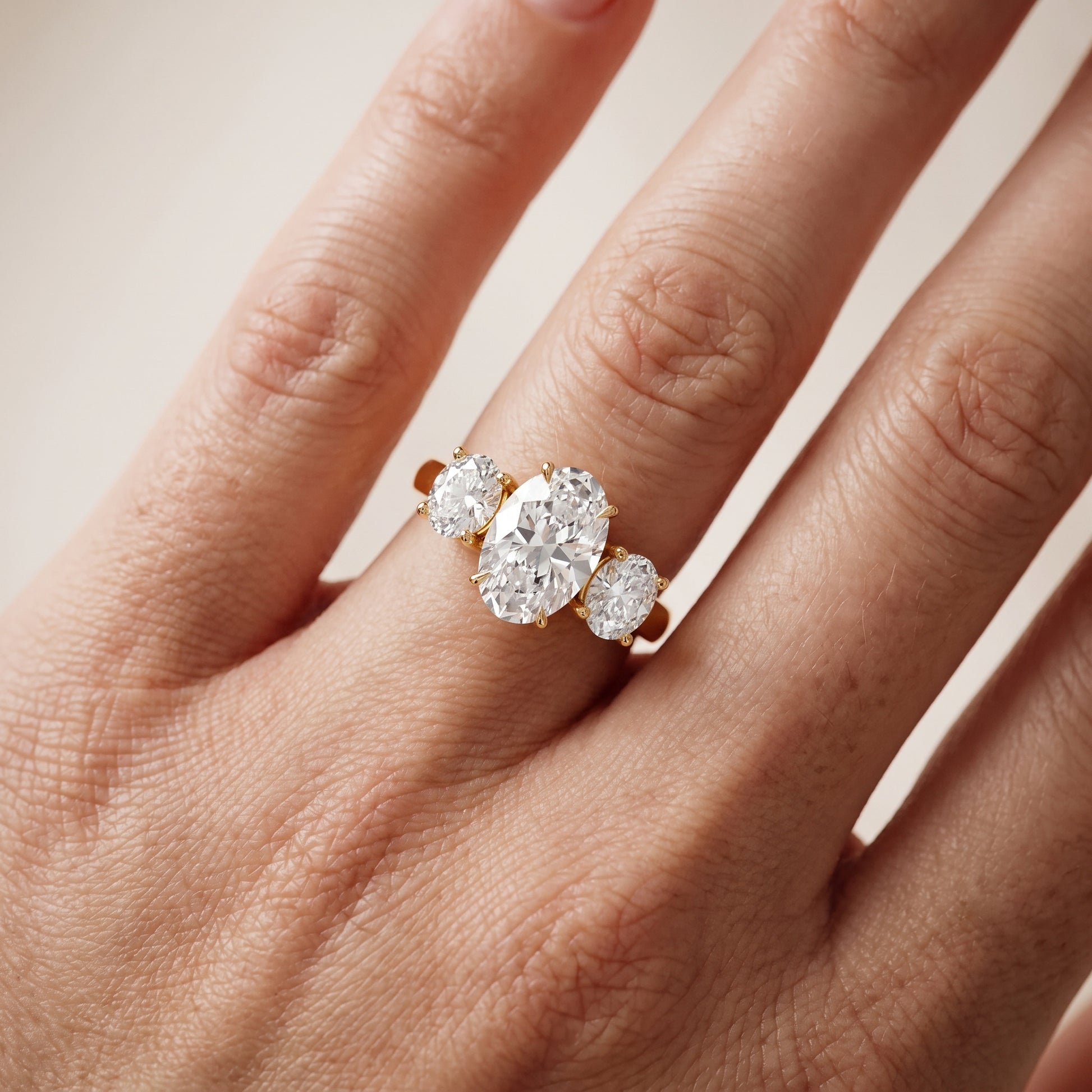 Esme Three-Stone Tapered Oval Diamond Ring in Yellow Gold - lifestyle.jpg