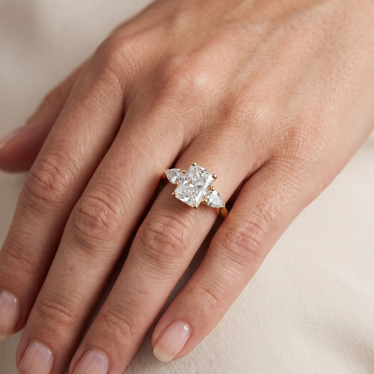 Sophia Three-Stone Radiant Diamond Engagement Ring in Yellow Gold - lifestyle.jpg