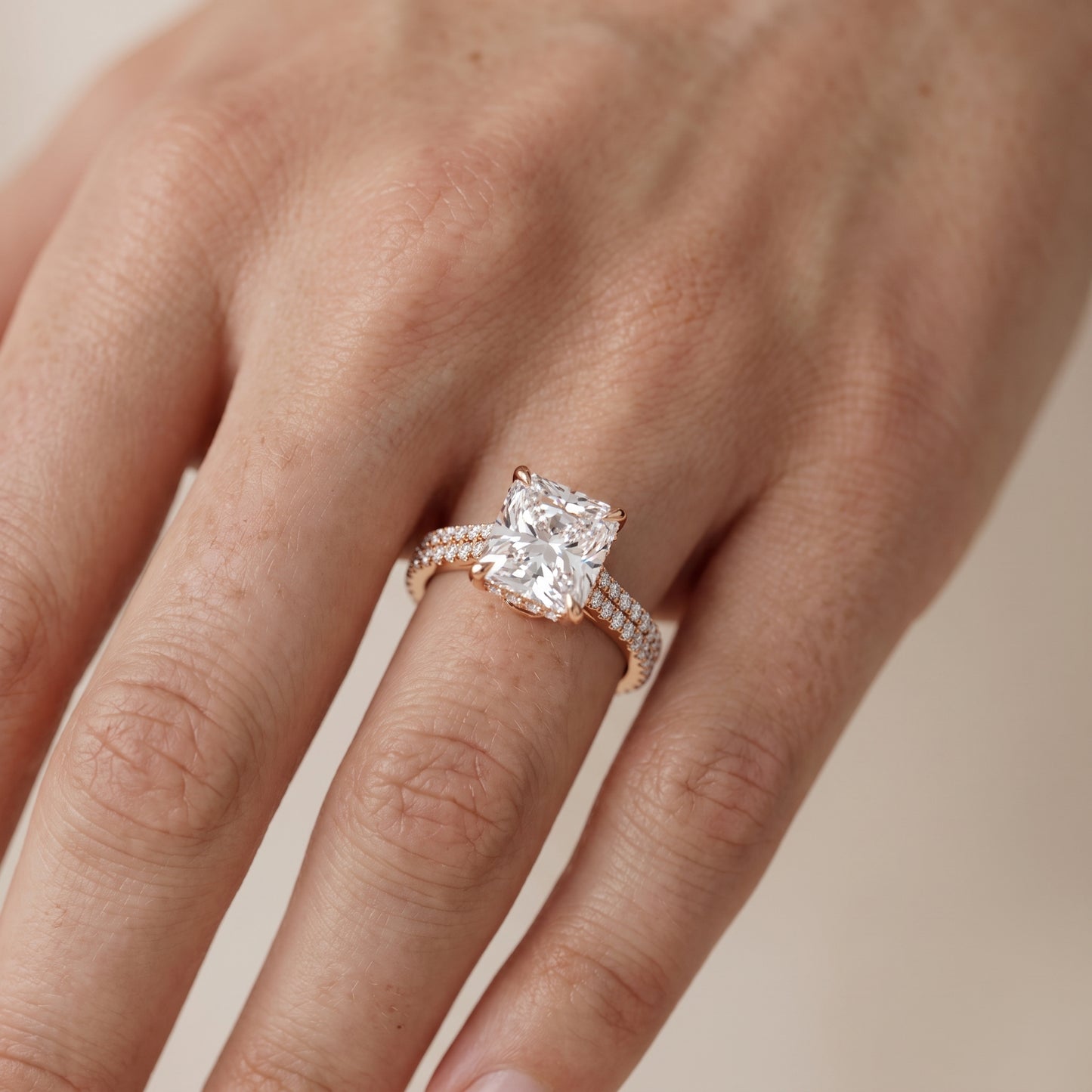 Della Hidden Halo Pavé Radiant Diamond Engagement Ring in Rose Gold - lifestyle.jpg