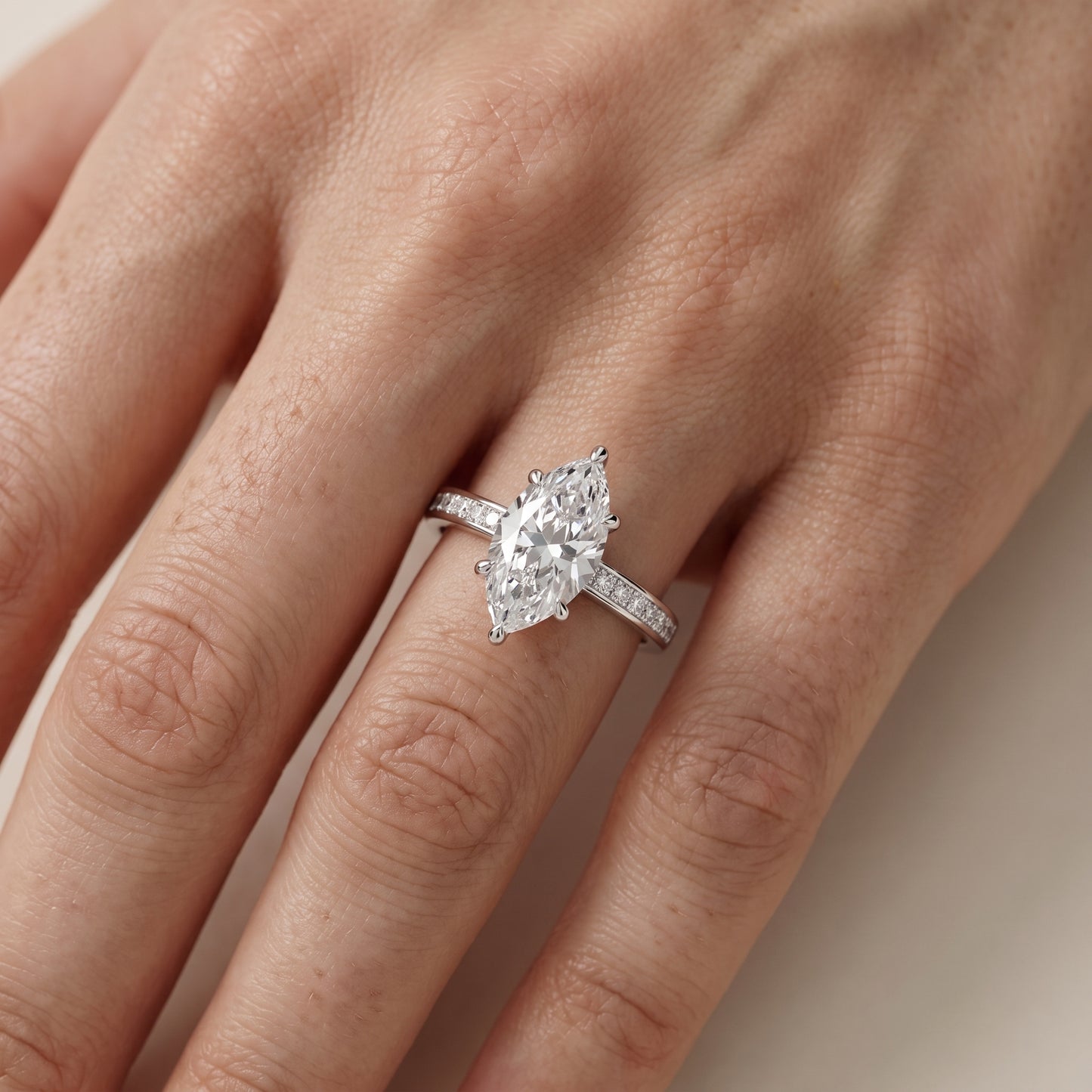 Maren Sidestone Channel Set Marquise Diamond Engagement Ring in Silver - lifestyle.jpg