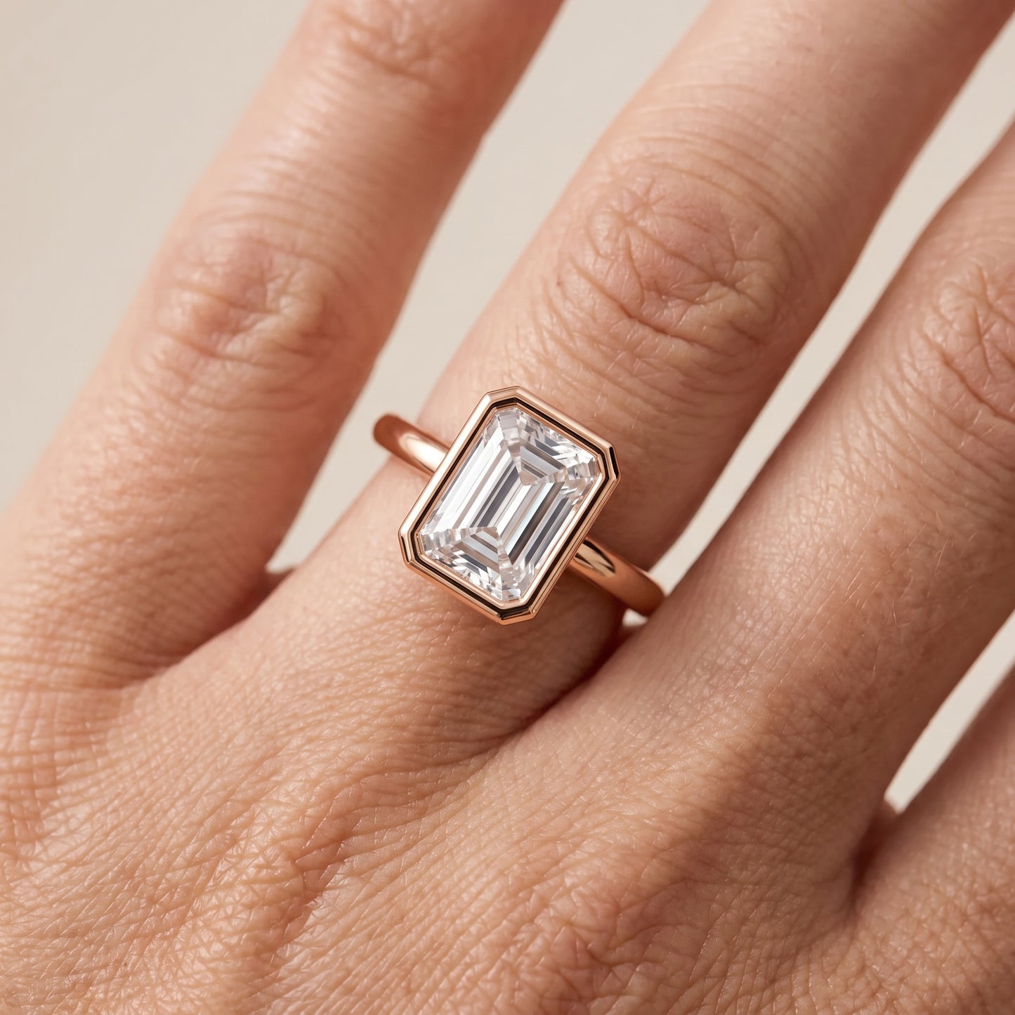 Maeve Bezel Solitaire Emerald Diamond Ring in Rose Gold - lifestyle.jpg