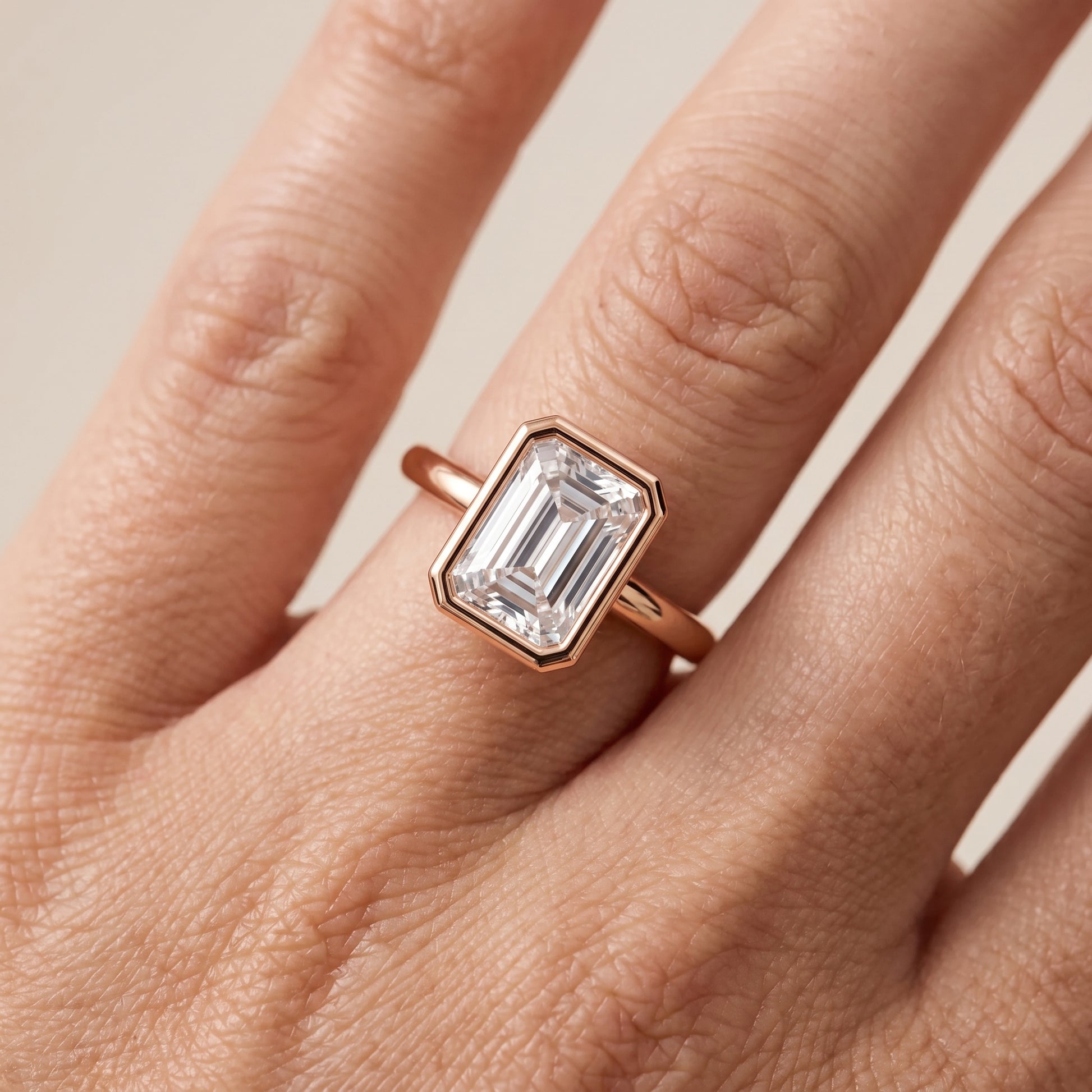 Maeve Bezel Solitaire Emerald Diamond Ring in Rose Gold - lifestyle.jpg