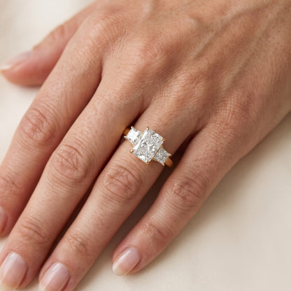 Aria Three-Stone Basket Radiant Diamond Engagement Ring in Yellow Gold - lifestyle.jpg