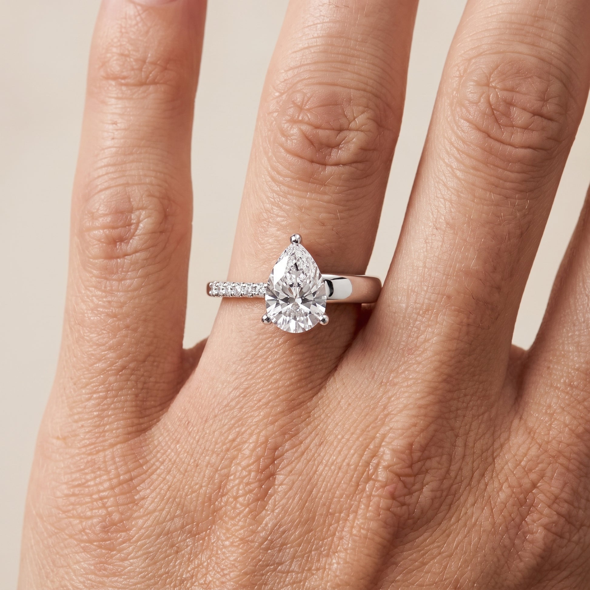 Rosie Solitaire Basket Pear Diamond Engagement Ring in White Gold - lifestyle.jpg