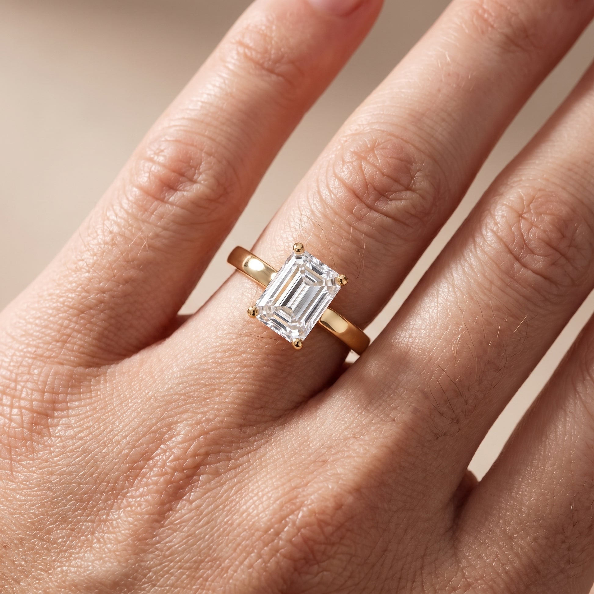 Delia Solitaire Emerald Diamond Engagement Ring in Yellow Gold - lifestyle.jpg