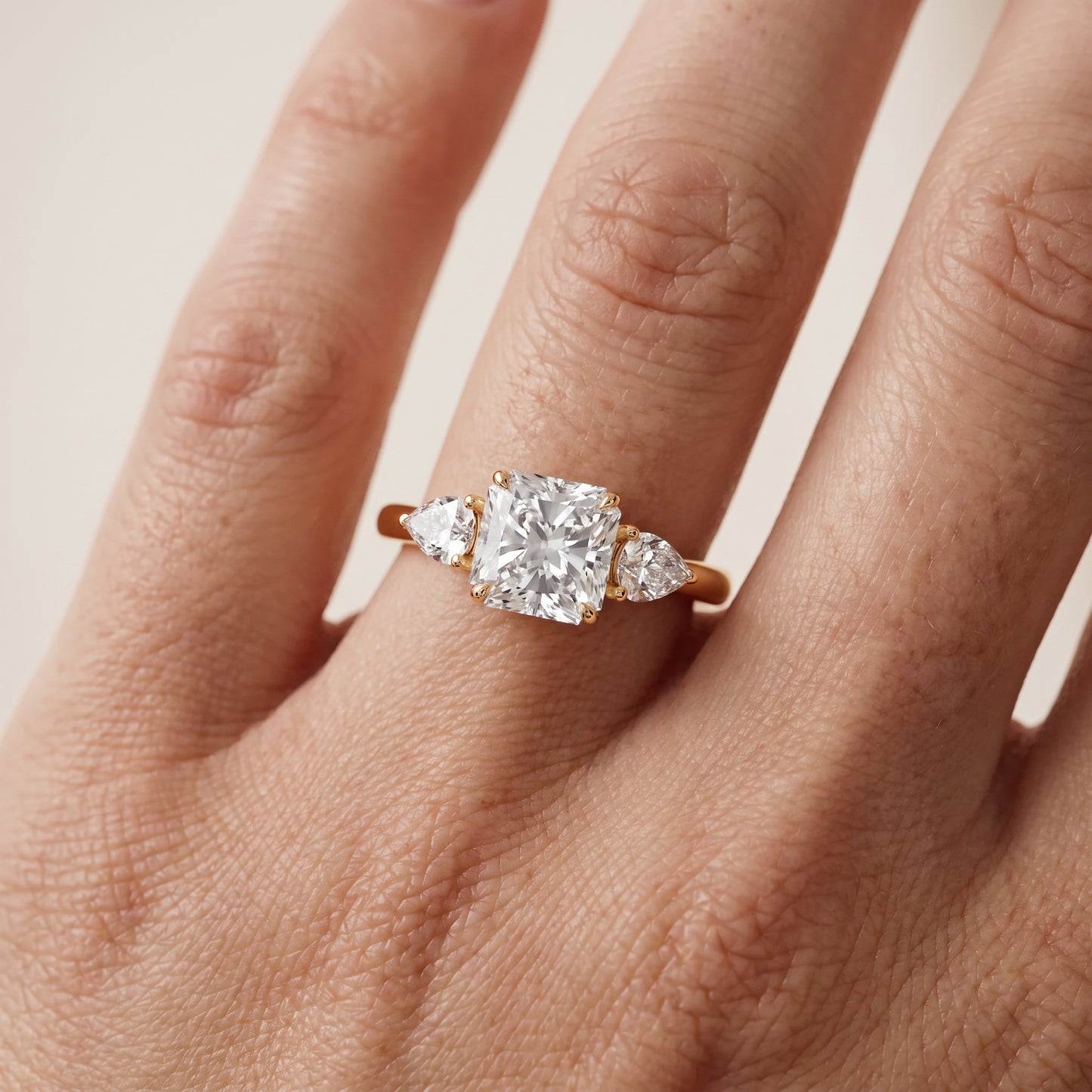 Phoebe Three-Stone Radiant Diamond Ring in Yellow Gold - lifestyle.jpg