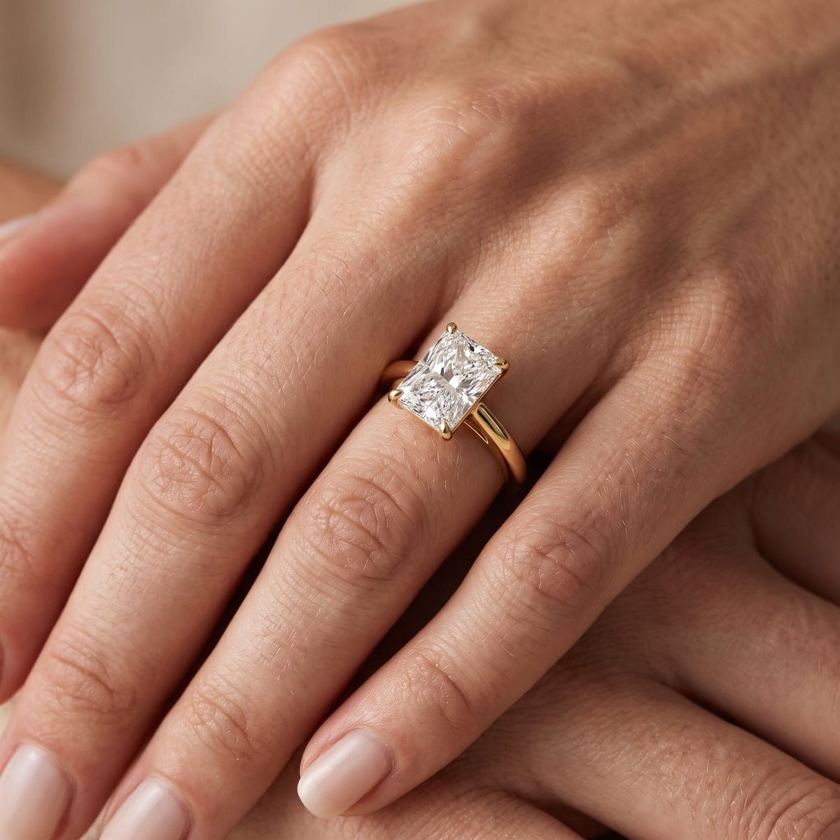 Sadie Cathedral Solitaire Radiant Diamond Engagement Ring in Yellow Gold - lifestyle.jpg
