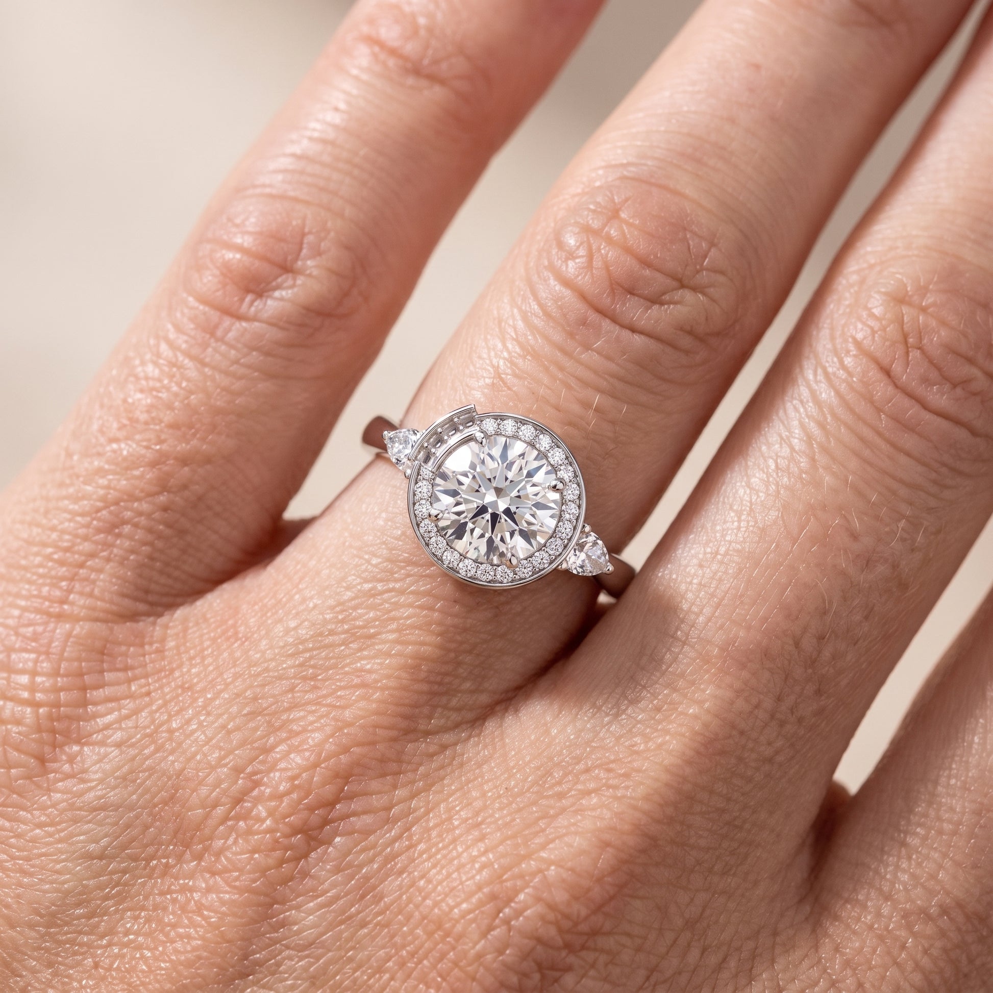 Eliza Halo Sidestone Round Diamond Engagement Ring in Platinum - lifestyle.jpg