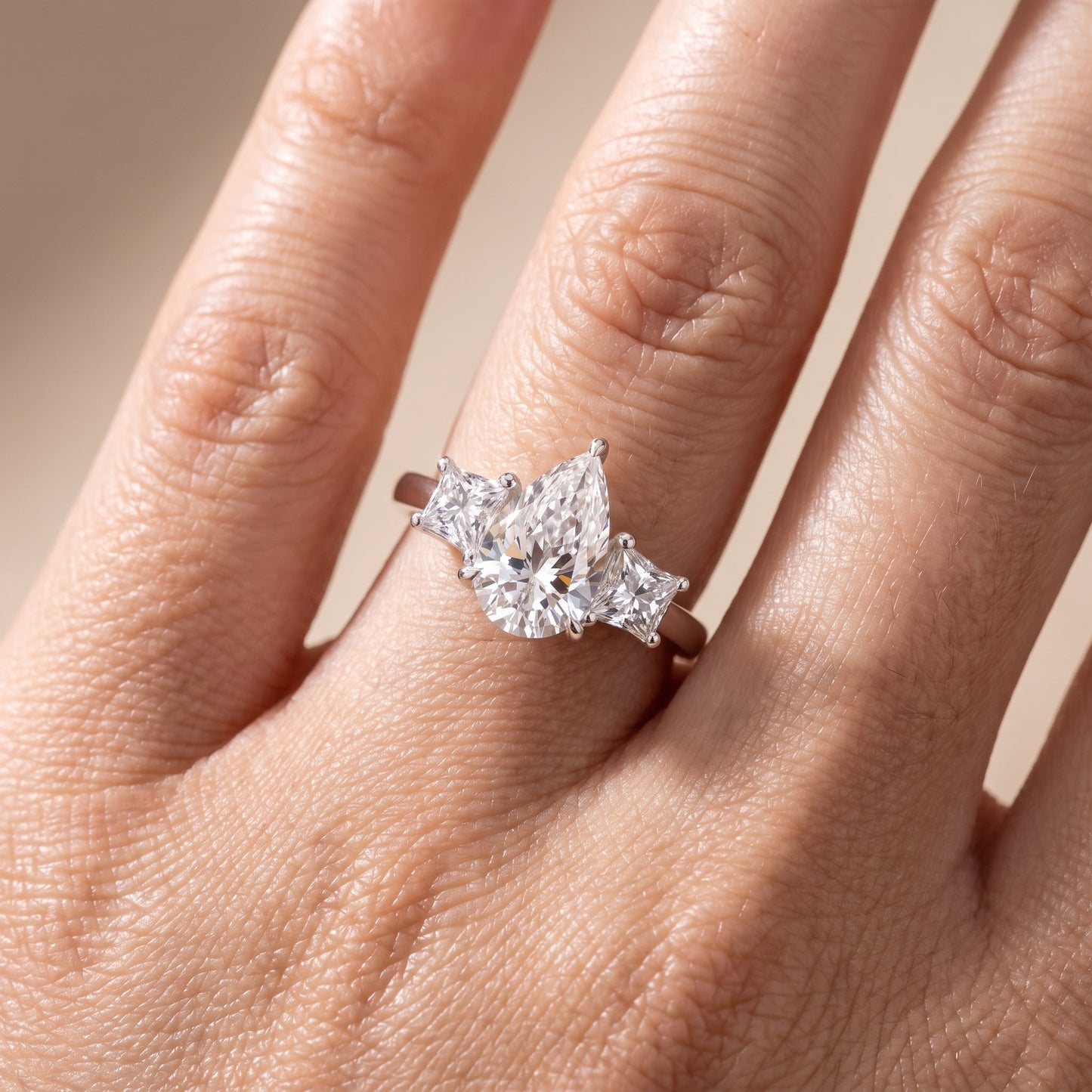 Sienna Three-Stone Pear Diamond Ring in Platinum - lifestyle.jpg