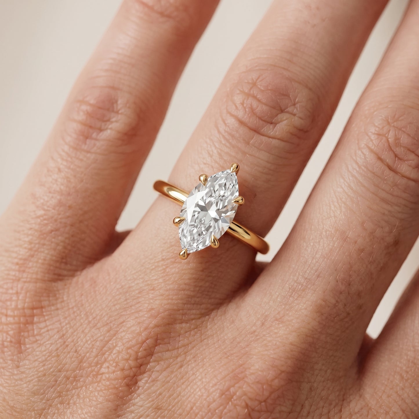 Nella Petite Solitaire Marquise Diamond Engagement Ring in Yellow Gold - lifestyle.jpg