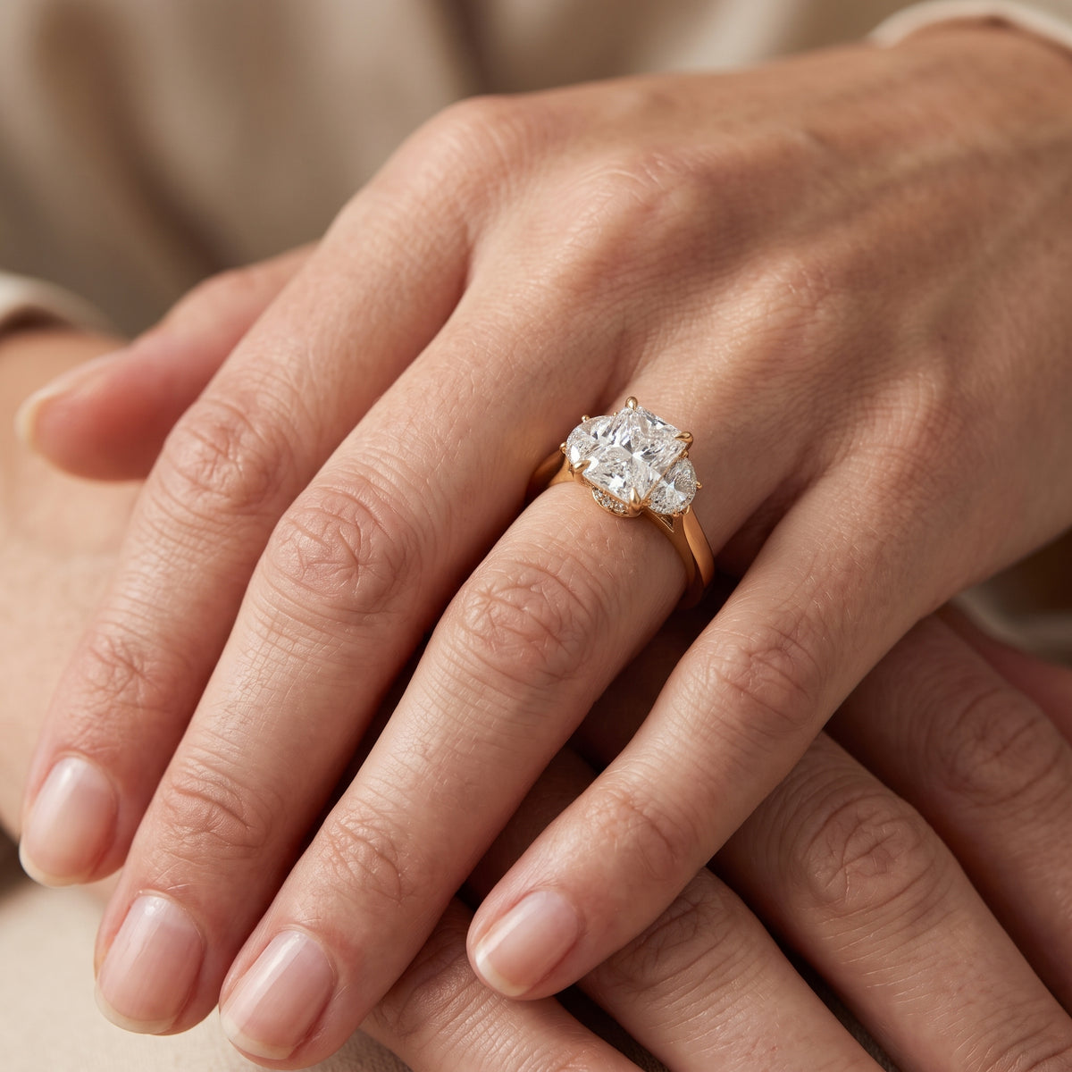 Romy Three-Stone Radiant Diamond Engagement Ring in Yellow Gold - lifestyle.jpg