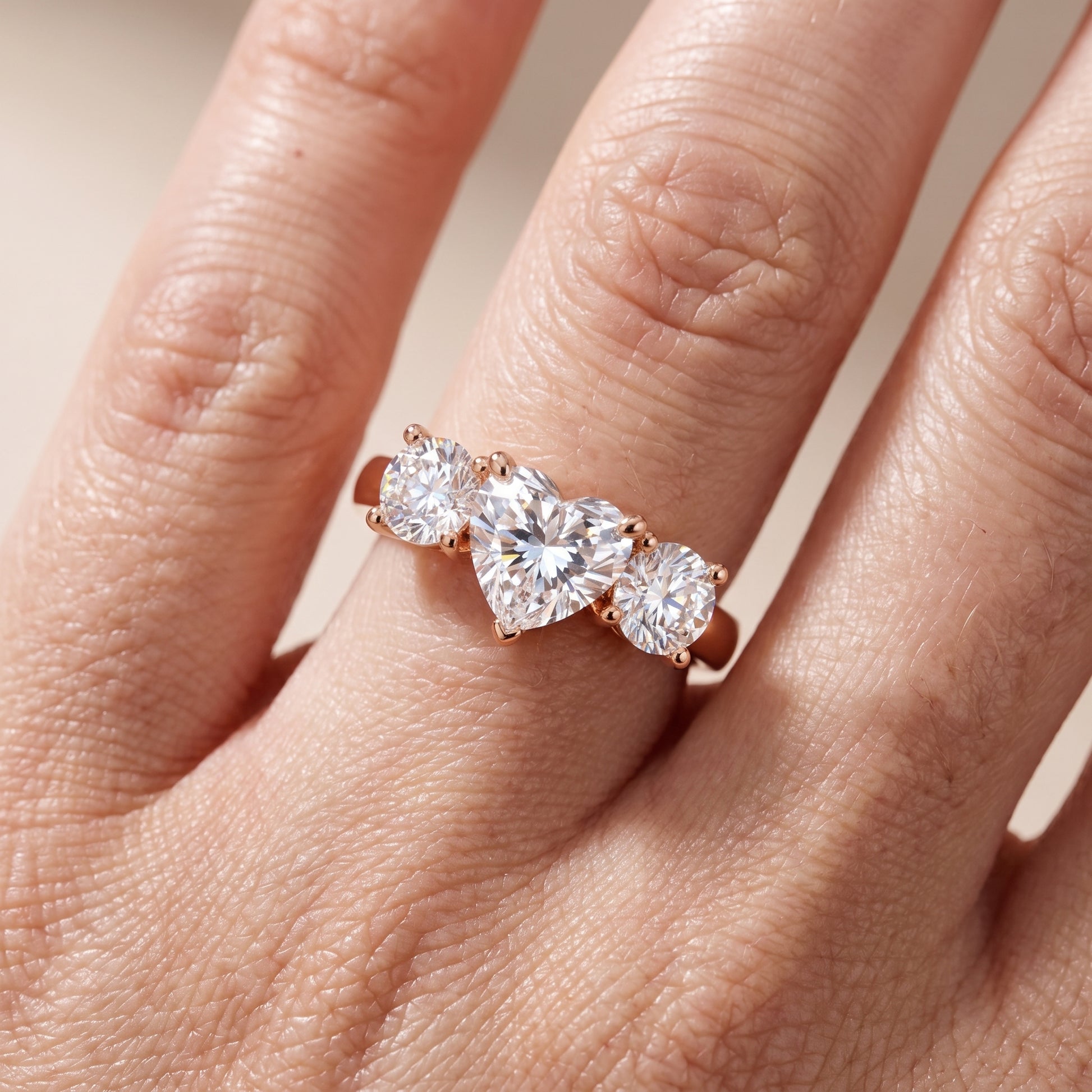 Callie Three-Stone Trellis Heart Diamond Engagement Ring in Rose Gold - lifestyle.jpg
