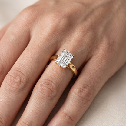 Edwina Crossover Solitaire Emerald Diamond Engagement Ring in Silver - lifestyle.jpg