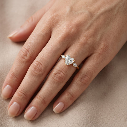 Lyra Three-Stone Heart Diamond Engagement Ring in Yellow Gold - lifestyle.jpg