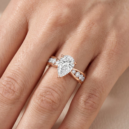 Noor Channel Set Sidestone Pear Diamond Engagement Ring in Rose Gold - lifestyle.jpg
