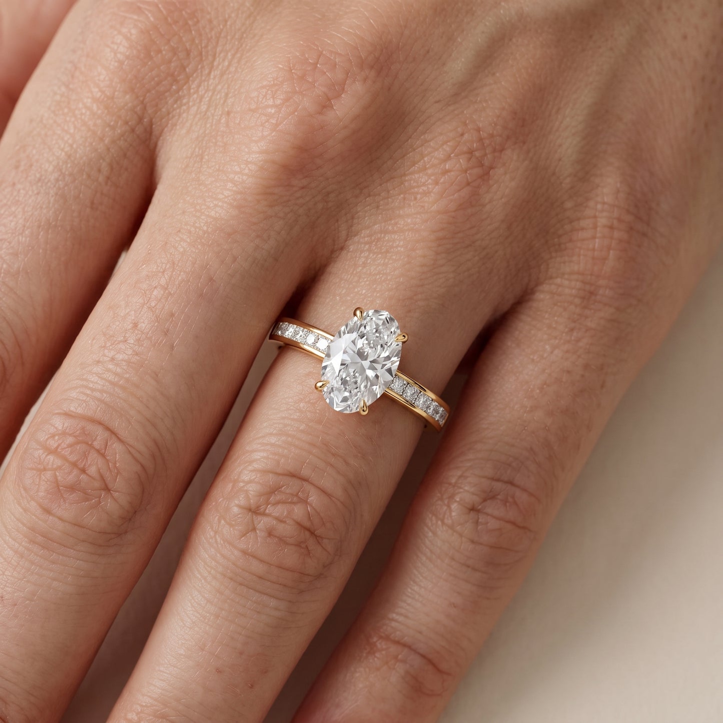 Maren Sidestone Channel Set Oval Diamond Engagement Ring in Yellow Gold - lifestyle.jpg