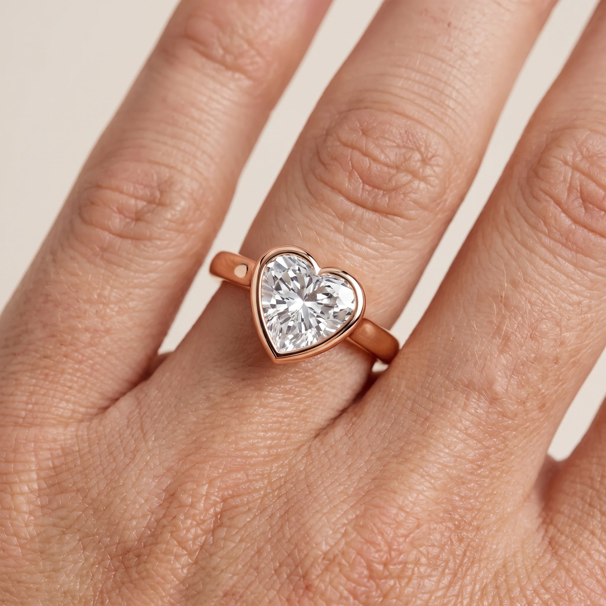 Jolie Bezel Solitaire Heart Diamond Engagement Ring in Rose Gold - lifestyle.jpg
