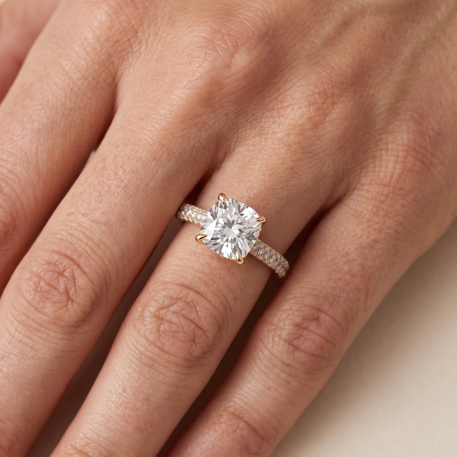 Della Hidden Halo Pavé Cushion Diamond Engagement Ring in Yellow Gold - lifestyle.jpg