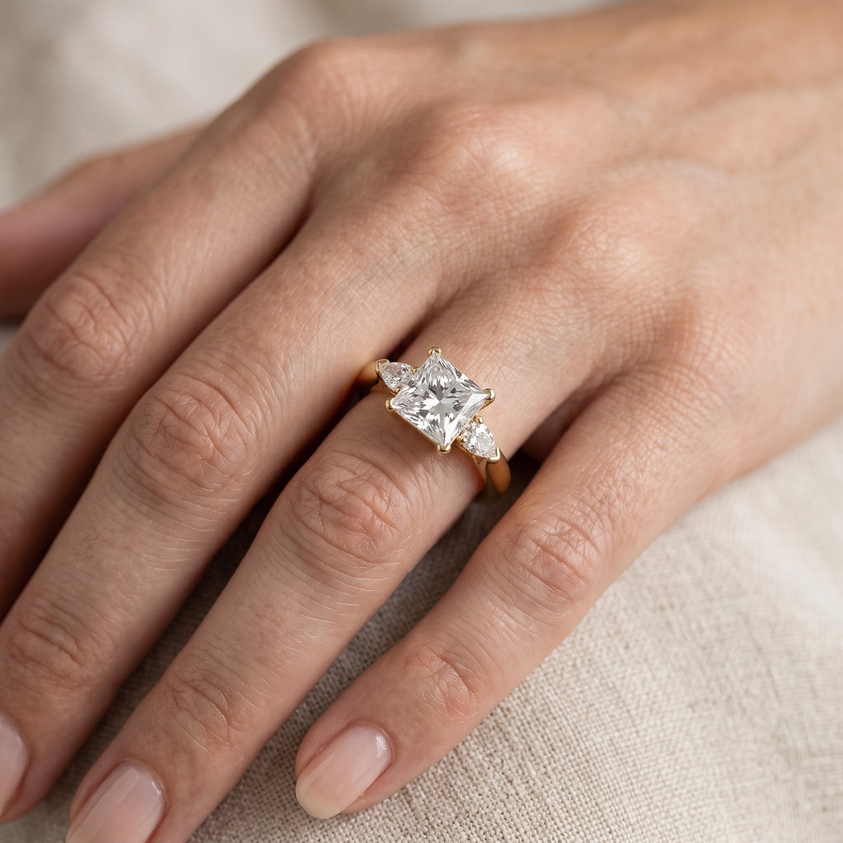 Dahlia Three-Stone Cathedral Princess Diamond Engagement Ring in White Gold - lifestyle.jpg