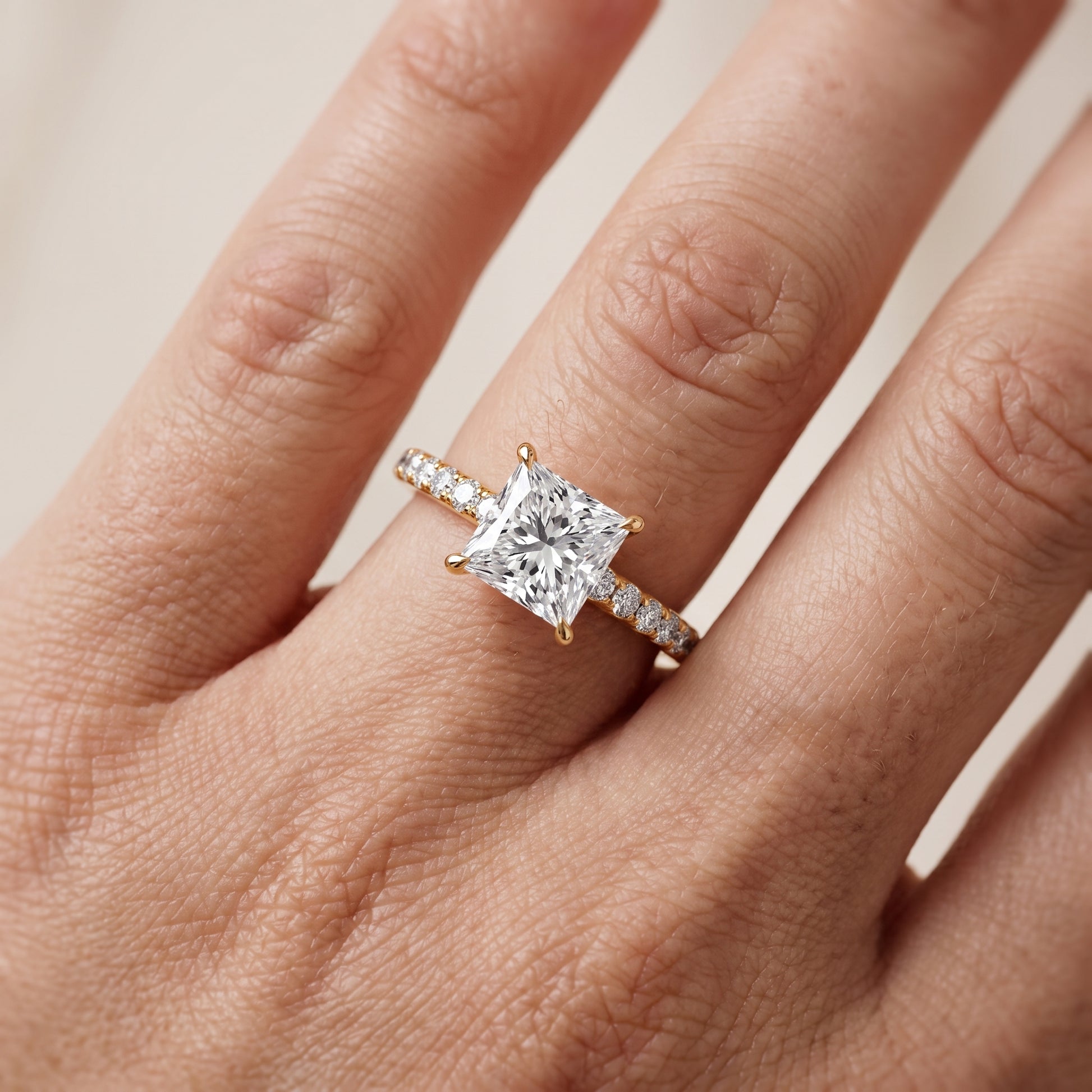 Thea Hidden Halo Pavé Princess Diamond Engagement Ring in Yellow Gold - lifestyle.jpg