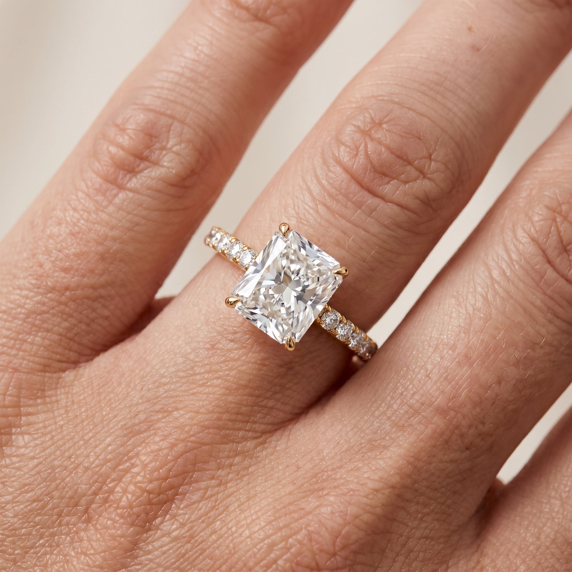 Juna French Pavé Solitaire Radiant Diamond Engagement Ring in Yellow Gold - lifestyle.jpg