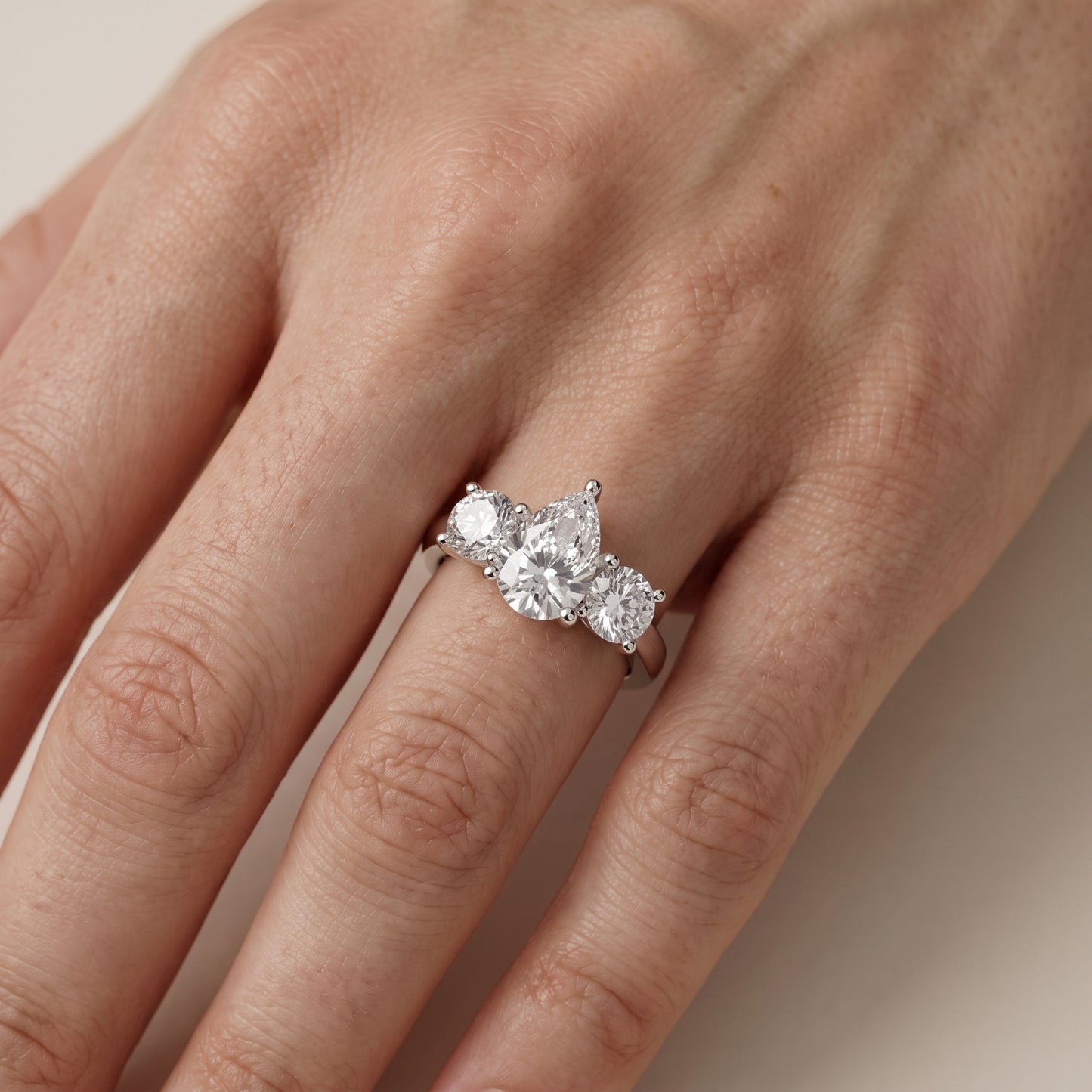 Callie Three-Stone Trellis Pear Diamond Engagement Ring in Platinum - lifestyle.jpg
