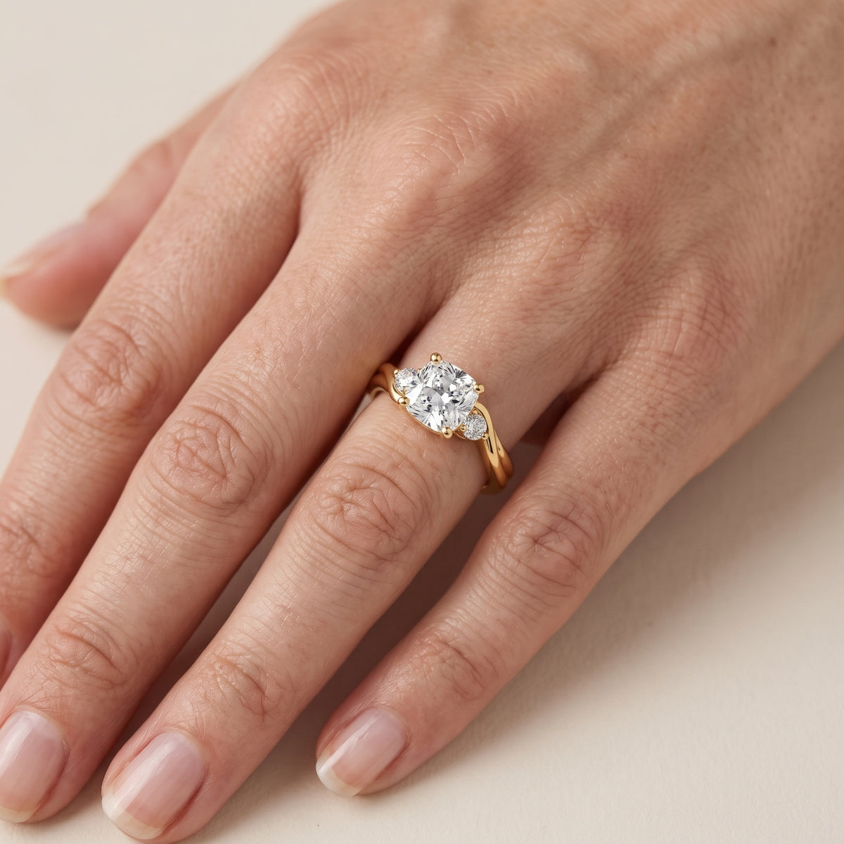 Rena Bypass Three-Stone Cushion Diamond Engagement Ring in Rose Gold - lifestyle.jpg