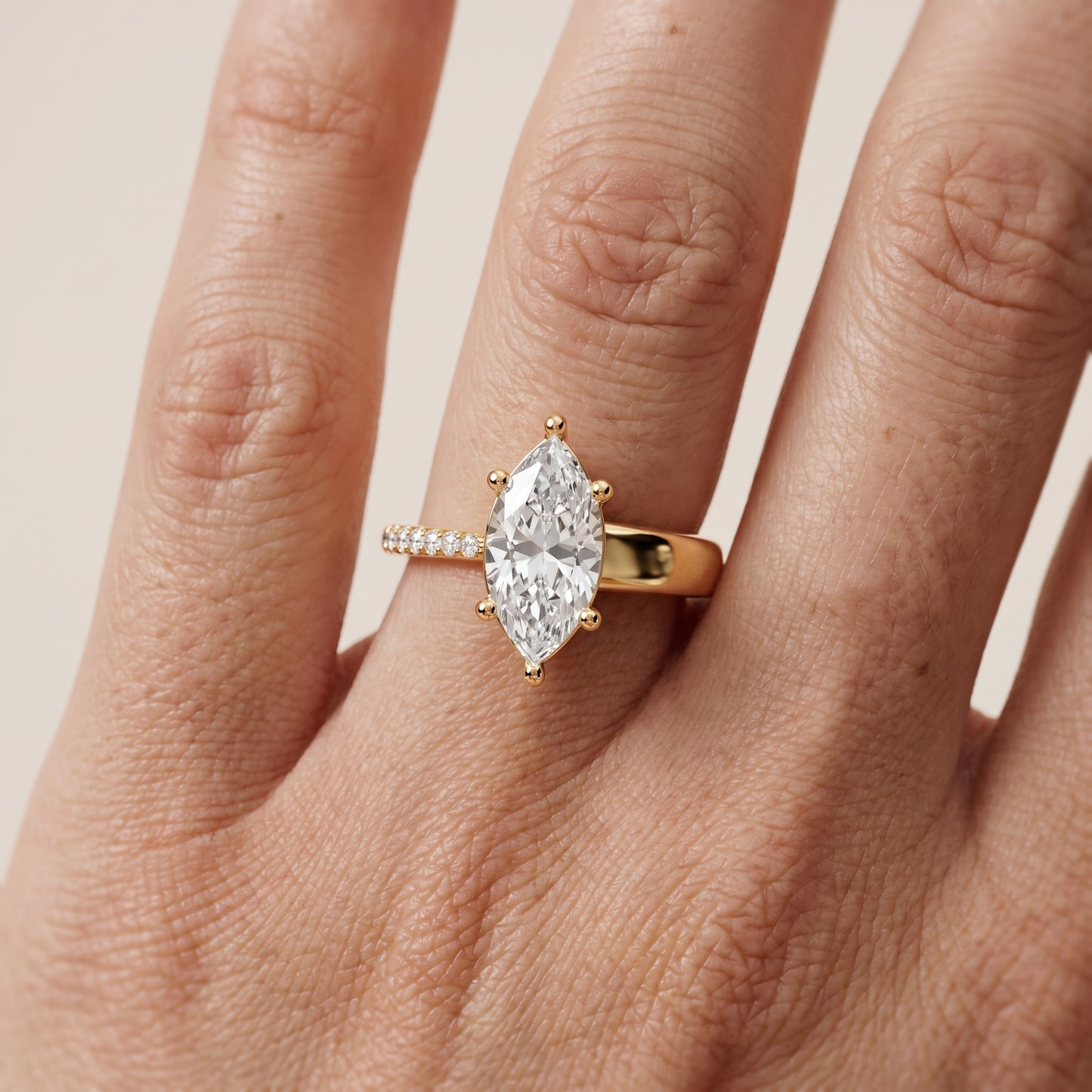 Rosie Solitaire Basket Marquise Diamond Engagement Ring in Yellow Gold - lifestyle.jpg