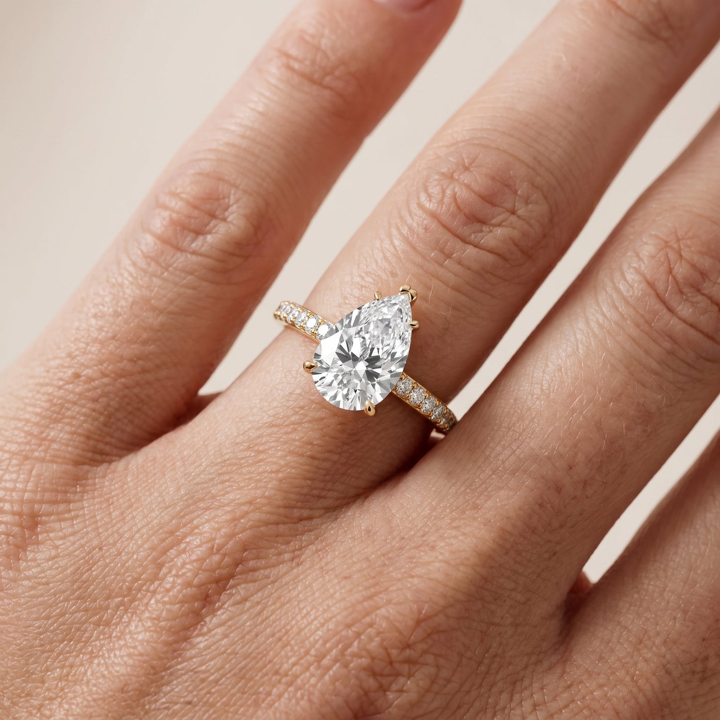 Violet Hidden Halo Pavé Pear Diamond Ring in Yellow Gold - lifestyle.jpg