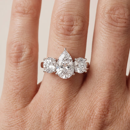 Esme Three-Stone Tapered Pear Diamond Ring in Platinum - lifestyle.jpg