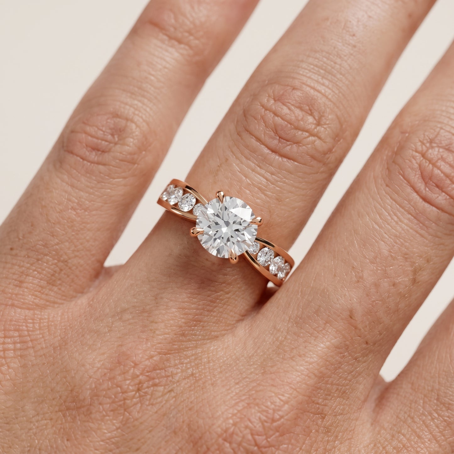 Noor Channel Set Sidestone Round Diamond Engagement Ring in Rose Gold - lifestyle.jpg