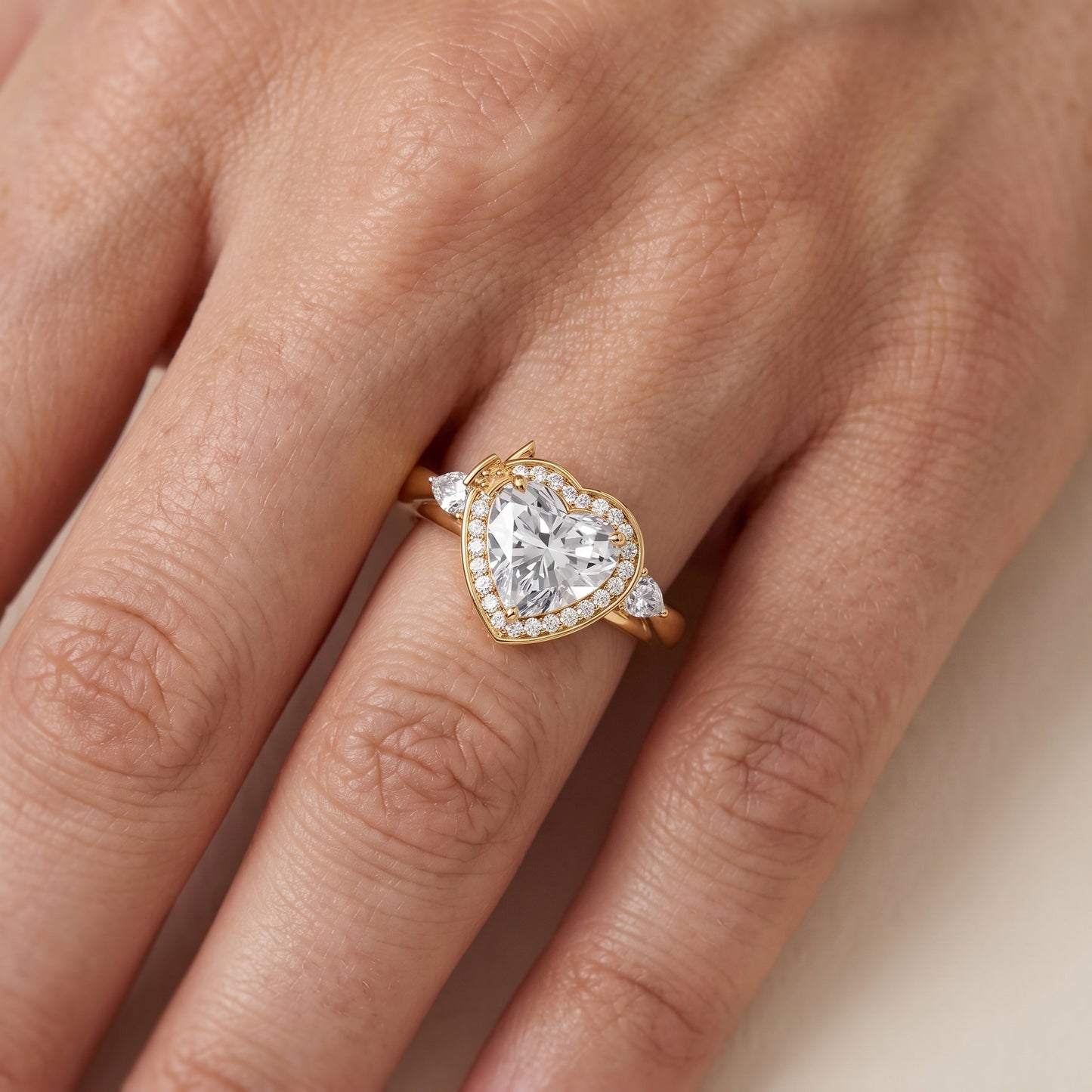 Eliza Halo Sidestone Heart Diamond Engagement Ring in Yellow Gold - lifestyle.jpg
