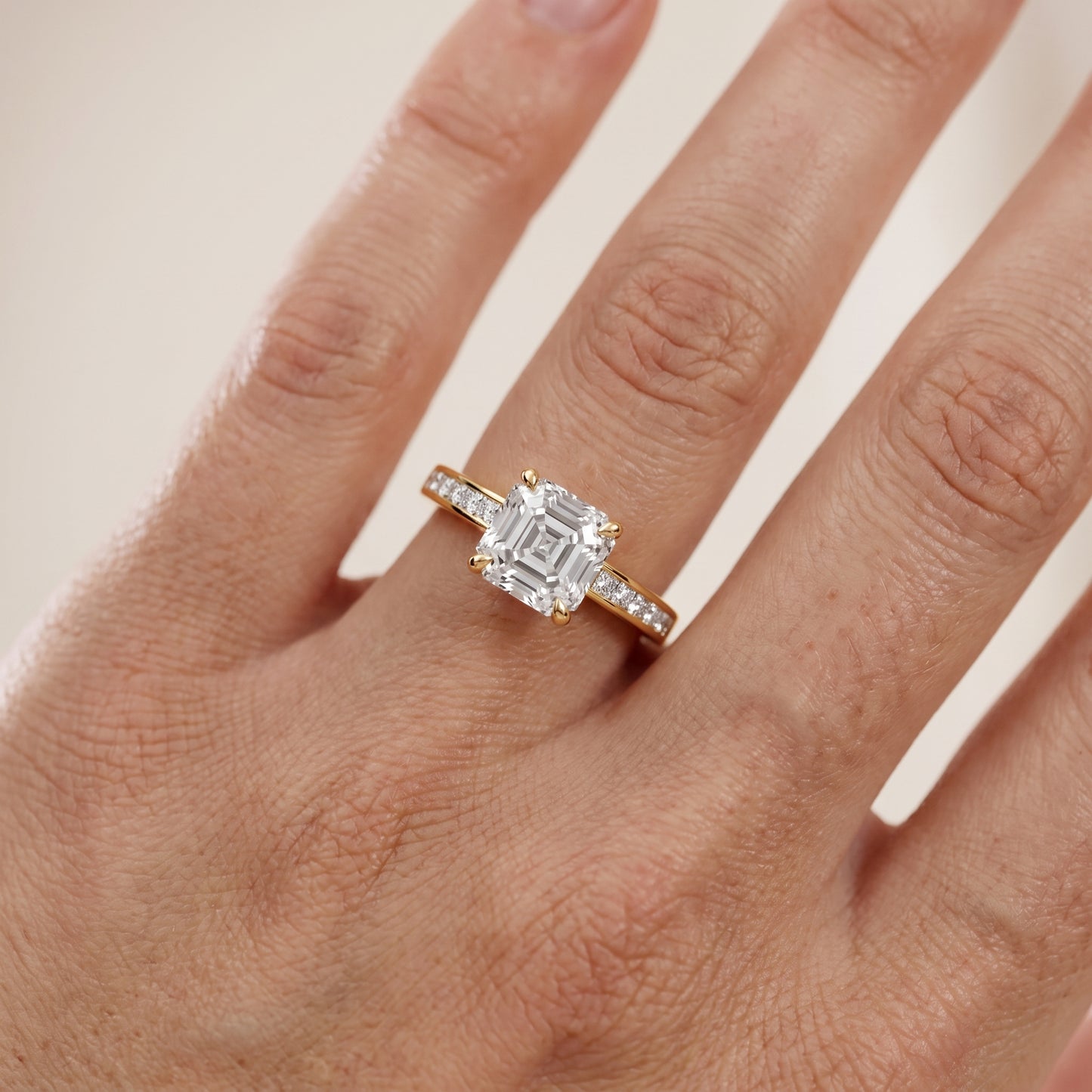 Maren Sidestone Channel Set Asscher Diamond Engagement Ring in Yellow Gold - lifestyle.jpg