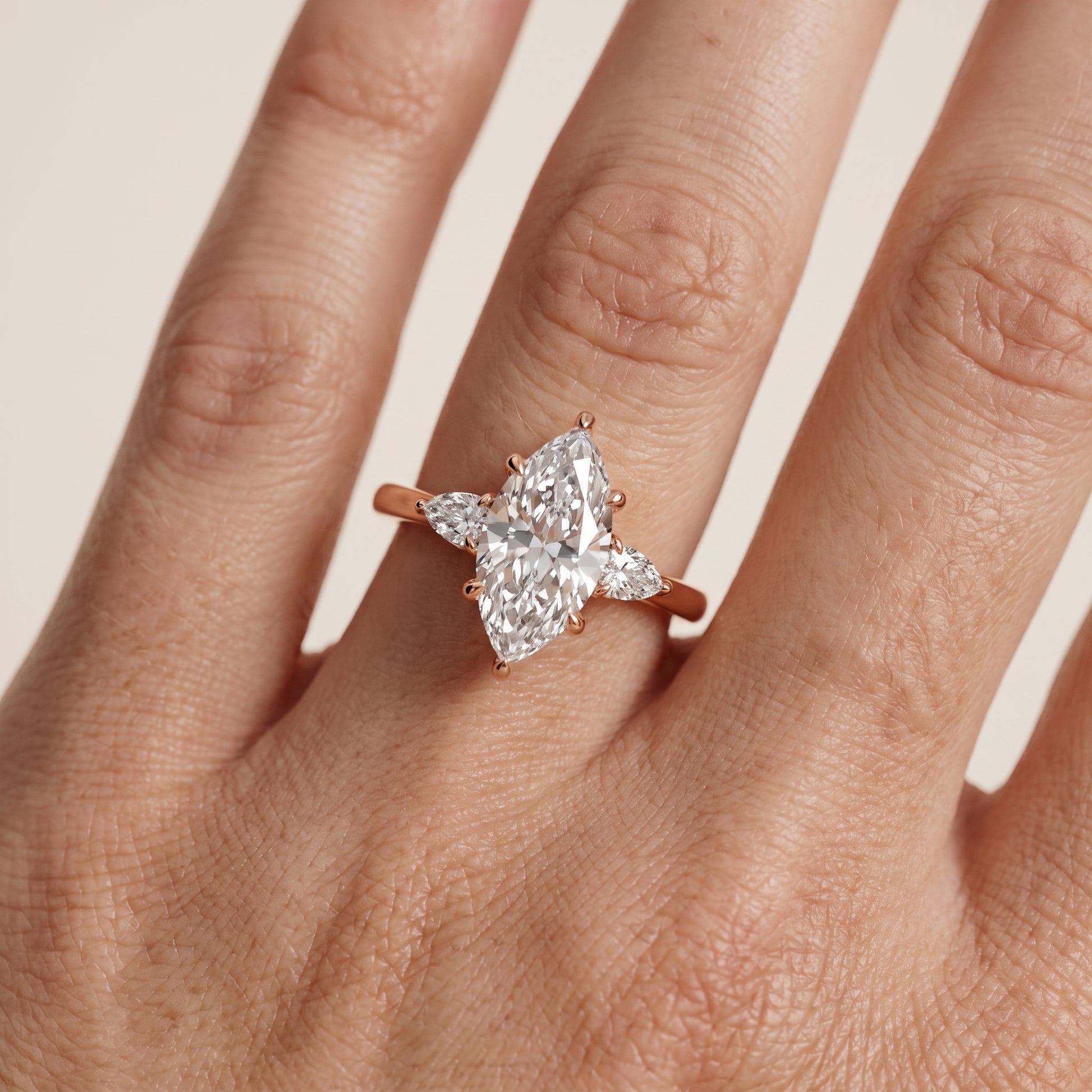 Leila Three-Stone Marquise Diamond Engagement Ring in Rose Gold - lifestyle.jpg