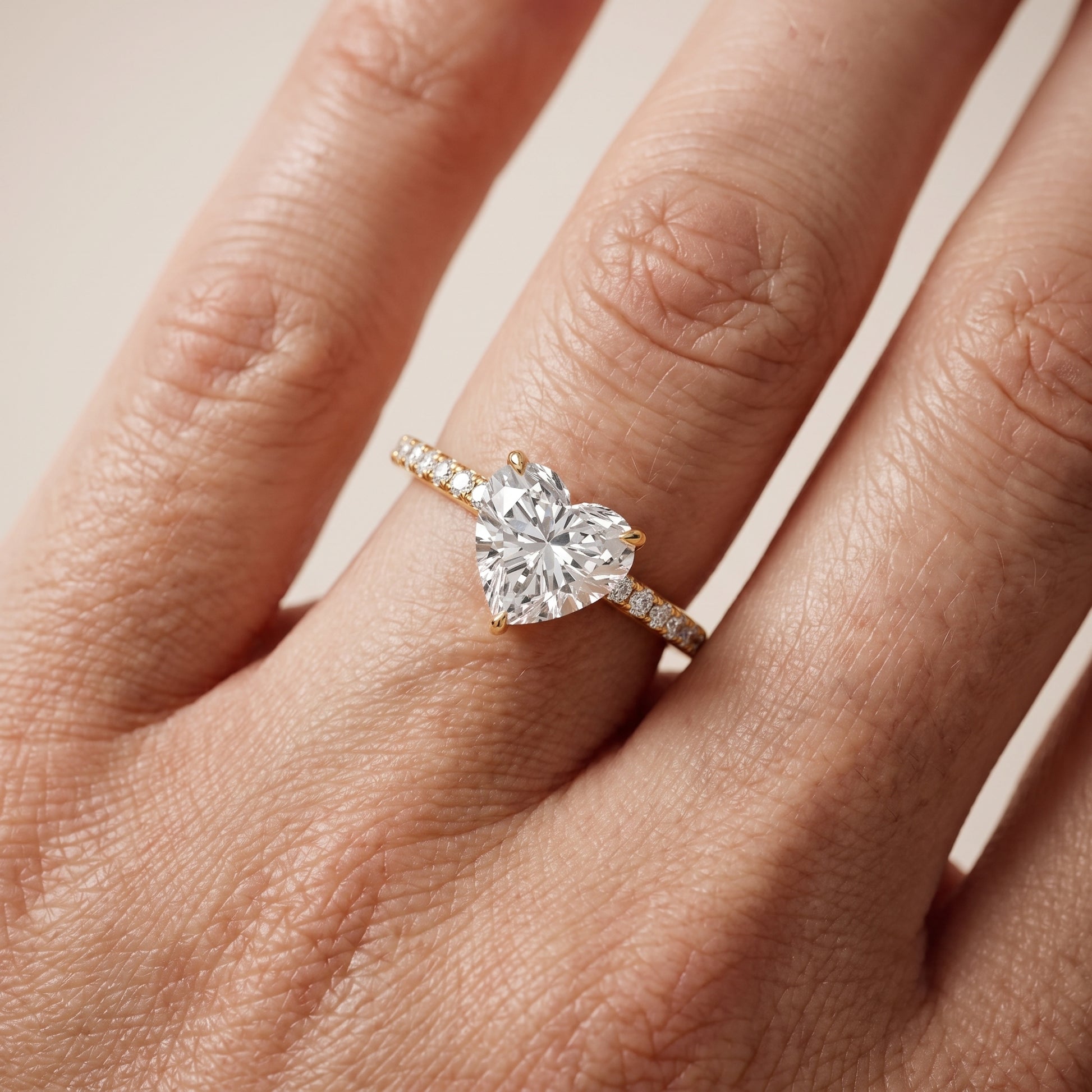 Ione Solitaire Pavé Heart Diamond Engagement Ring in Yellow Gold - lifestyle.jpg