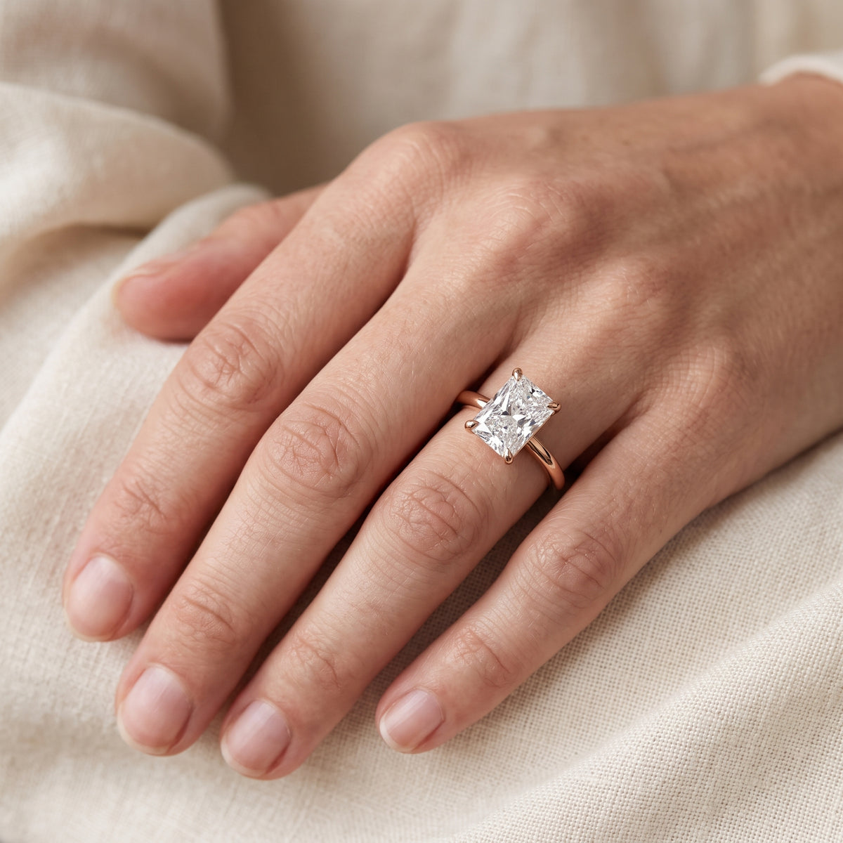 Nella Petite Solitaire Radiant Diamond Engagement Ring in Rose Gold - lifestyle.jpg