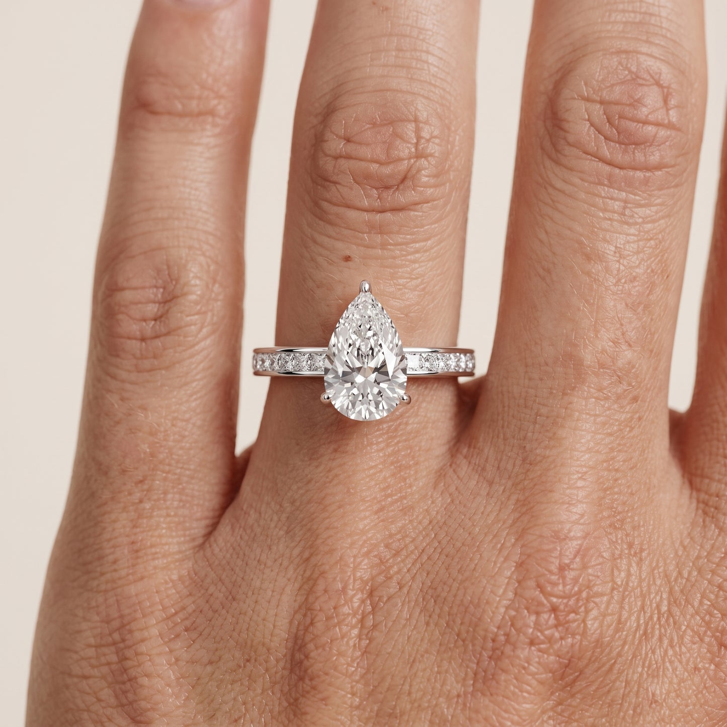 Brielle Channel Set Solitaire Pear Diamond Ring in White Gold - lifestyle.jpg