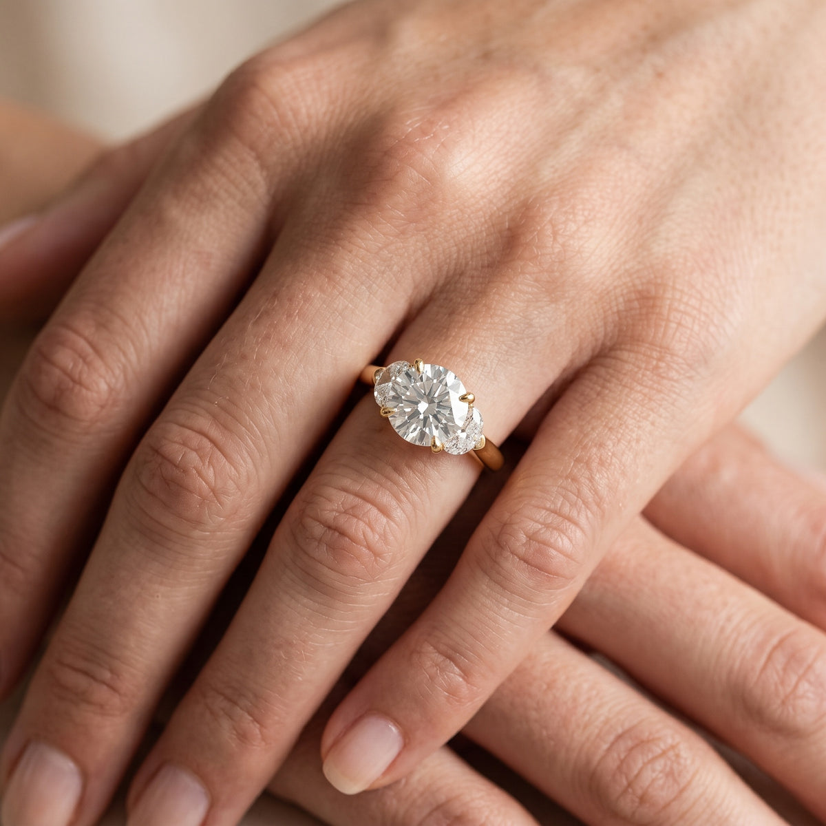 Elia Half-Moon Three-Stone Round Diamond Engagement Ring in Platinum - lifestyle.jpg