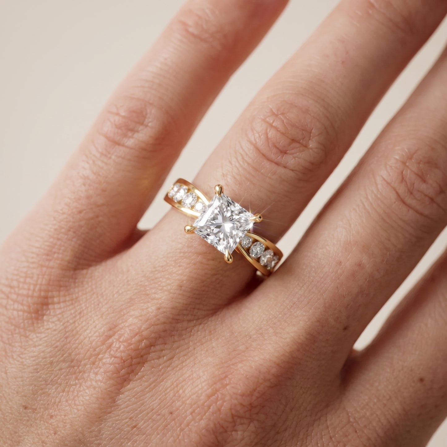 Noor Channel Set Sidestone Princess Diamond Engagement Ring in Yellow Gold - lifestyle.jpg