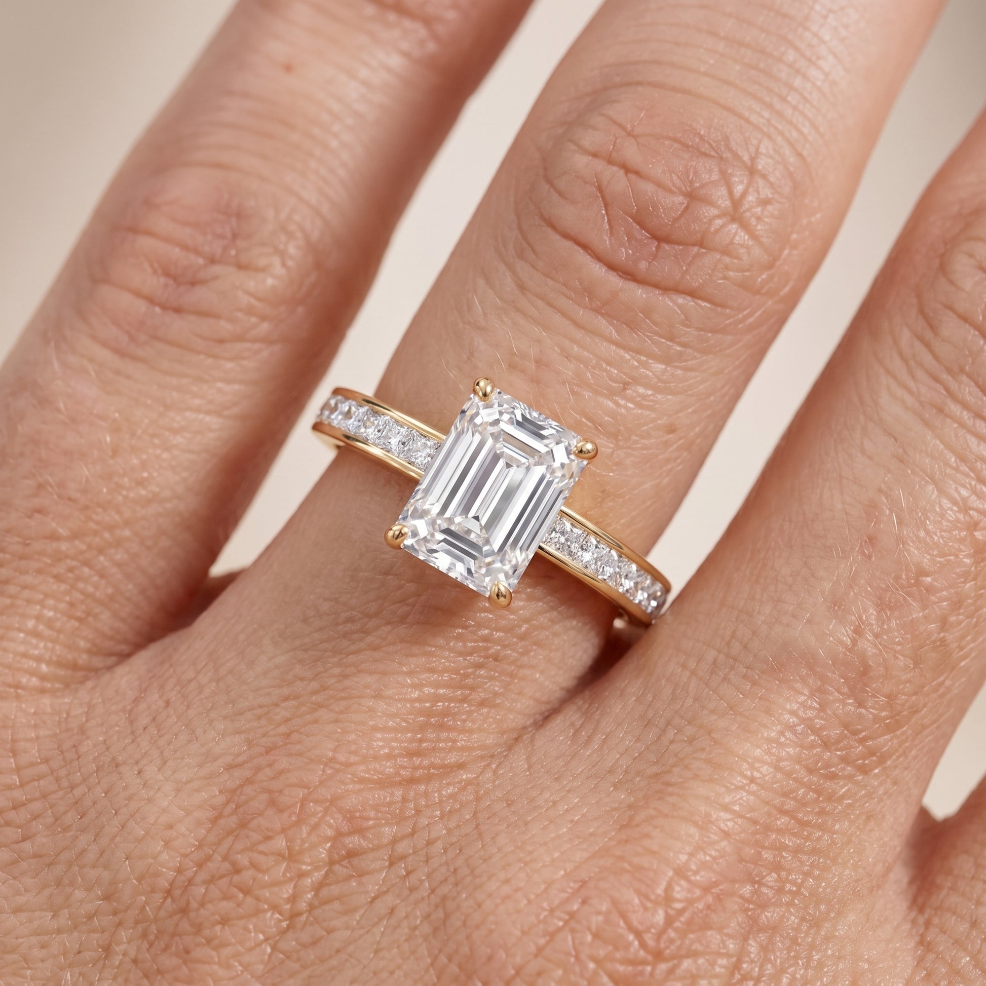 Brielle Channel Set Solitaire Emerald Diamond Ring in Yellow Gold - lifestyle.jpg